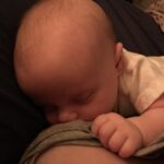 baby feeding at breast